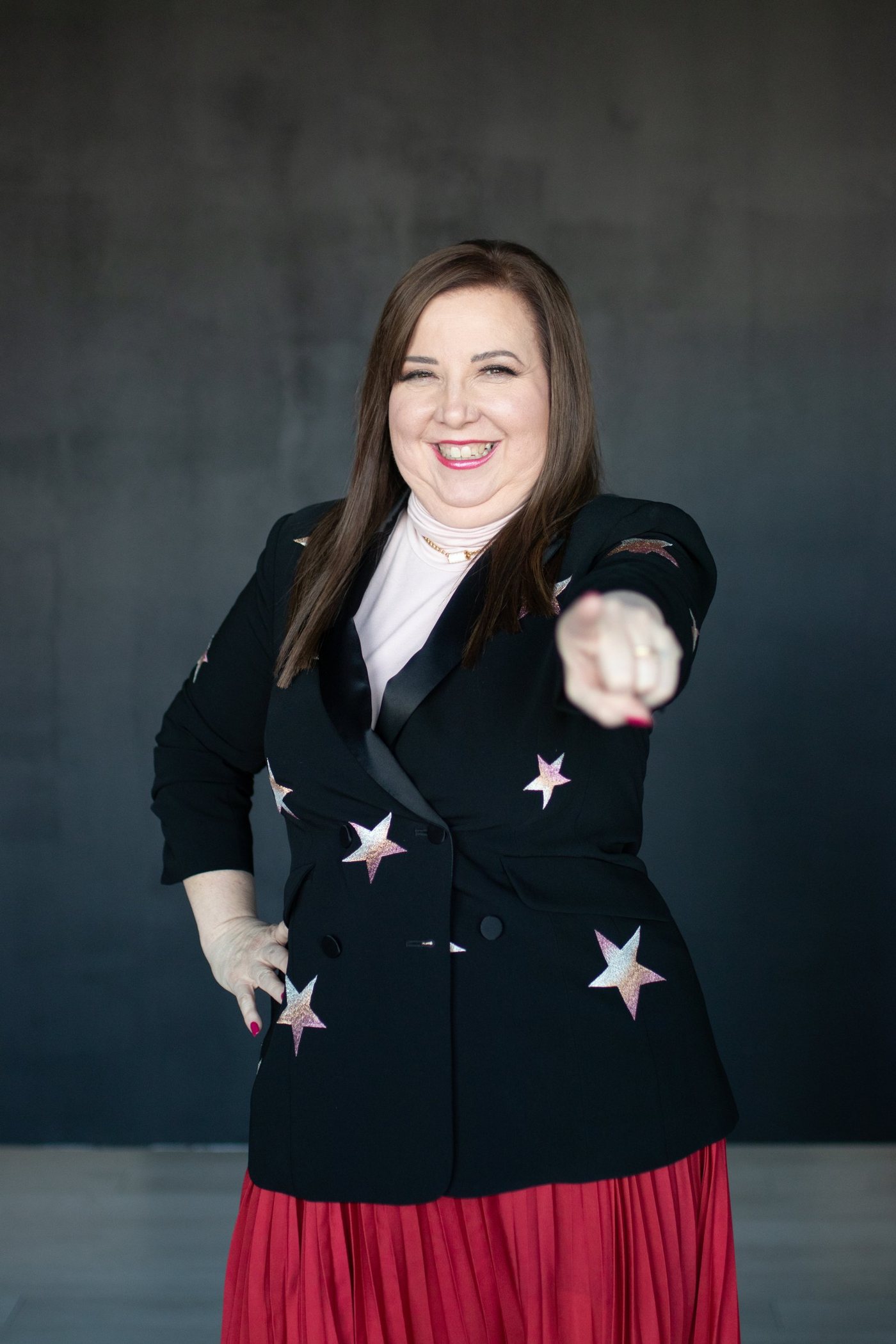 Deborah Daniel, CPA, pointing while explaining a payroll question